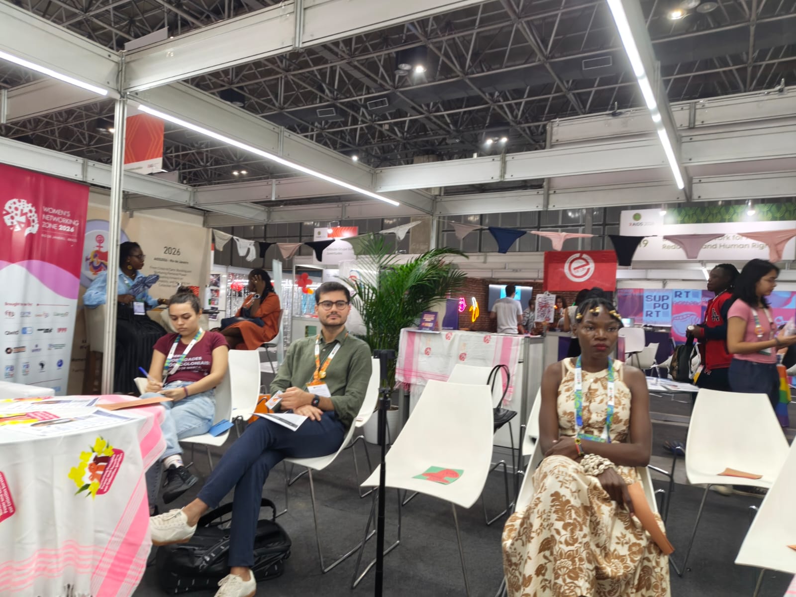 Participants at the Women's Networking Zone booth during AIDS 2026